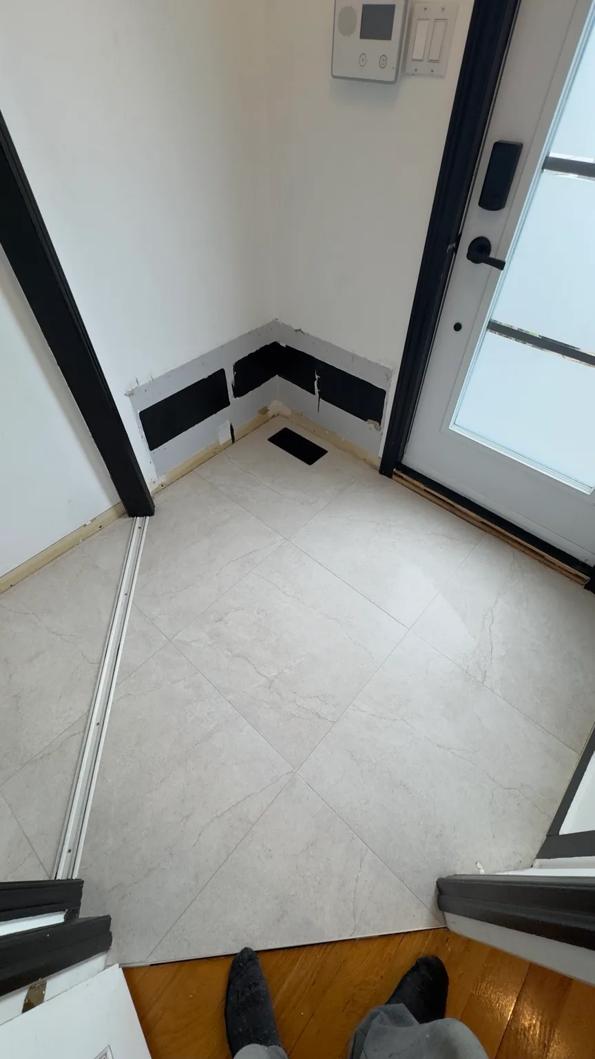 New porcelain floor in the entryway after the renovation.